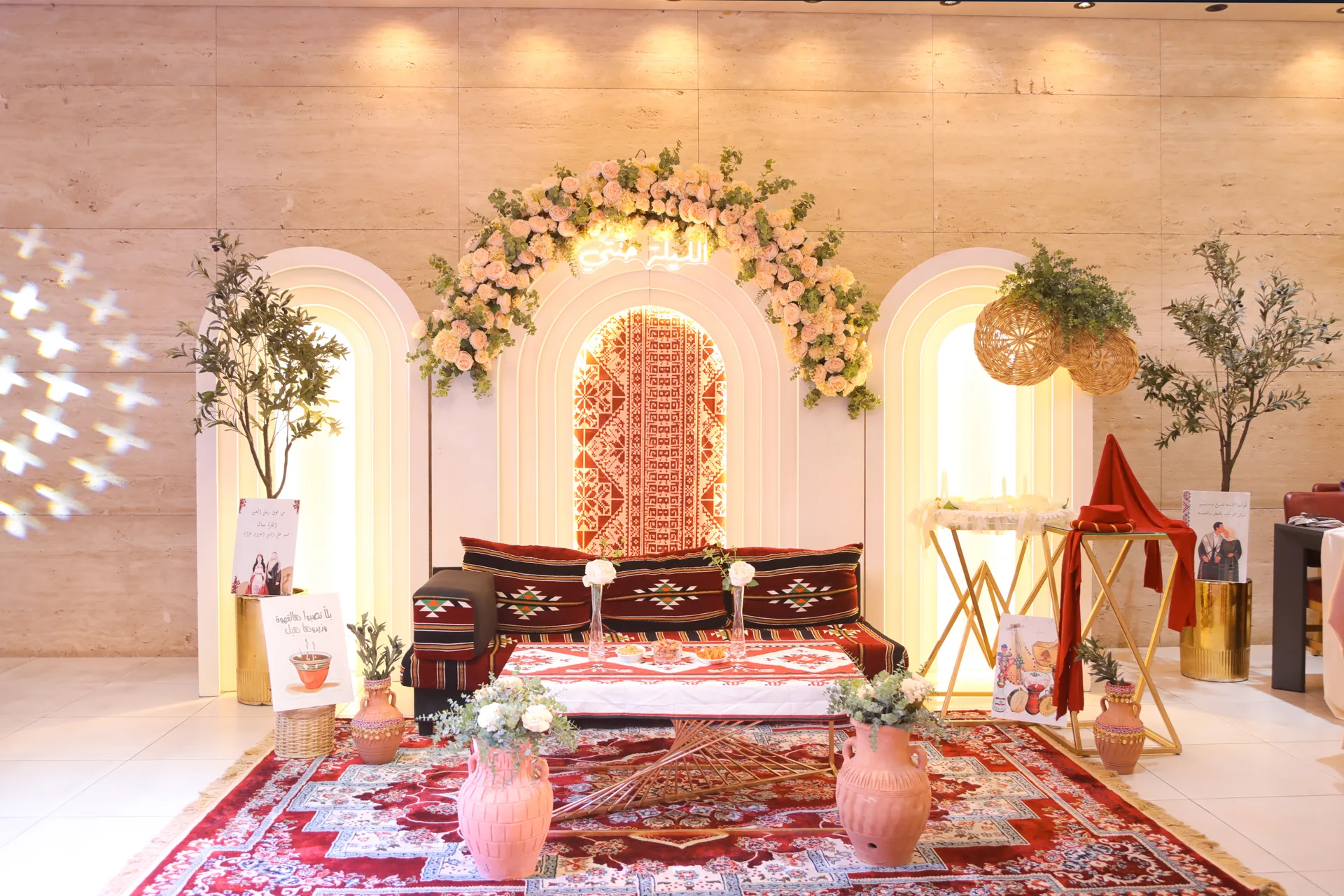 Traditional henna setup with rug and pastel florals