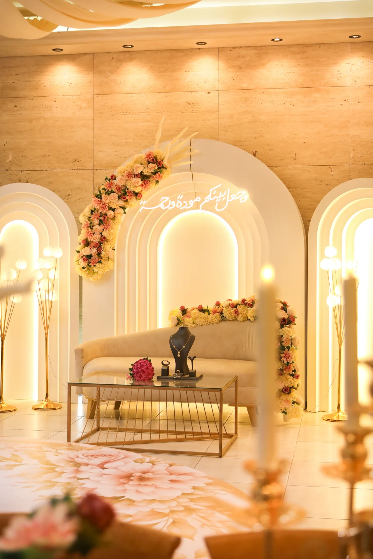 Engagement stage with lit arches and roses