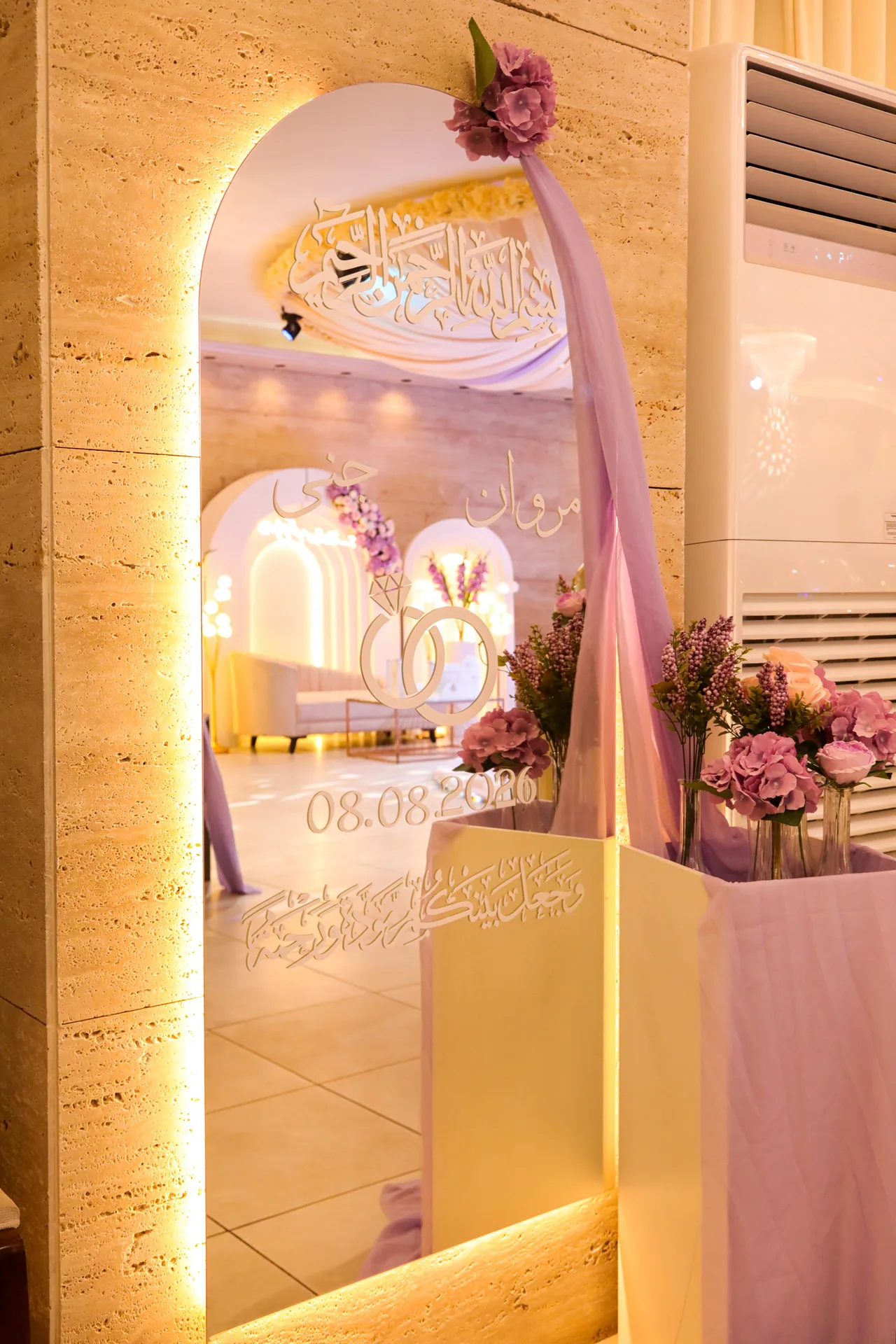 Illuminated arch entrance with welcome sign