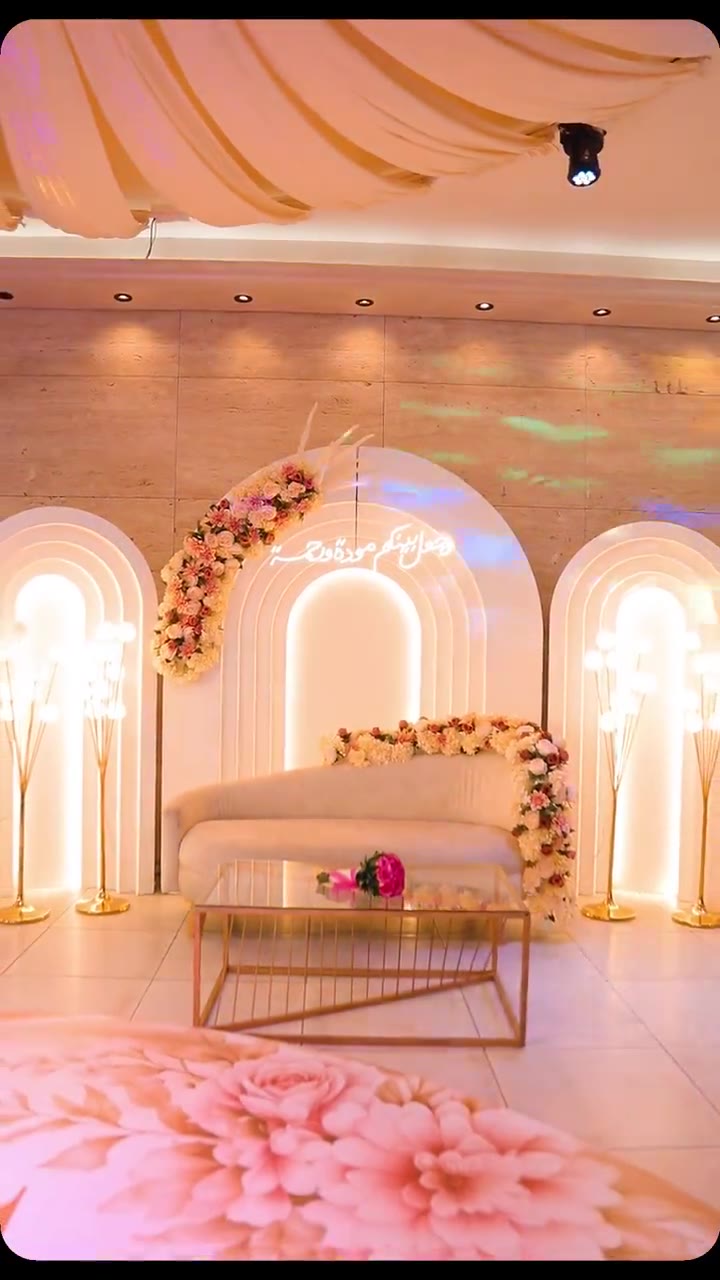Engagement reel with pink arches and floral floor