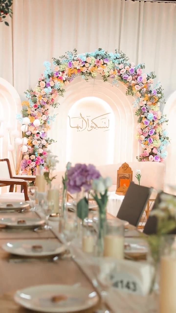 Engagement reel with pastel floral arch