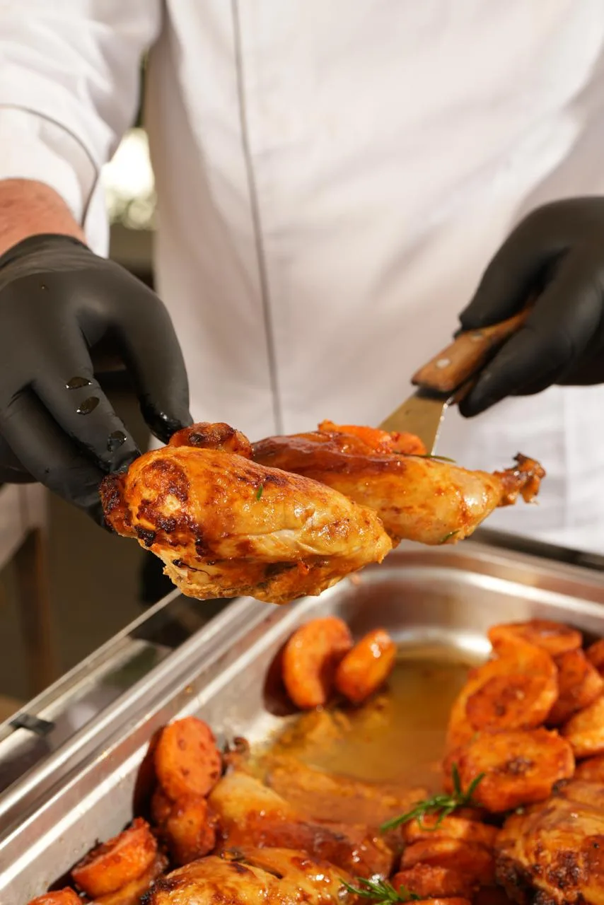 Chef carving roast chicken